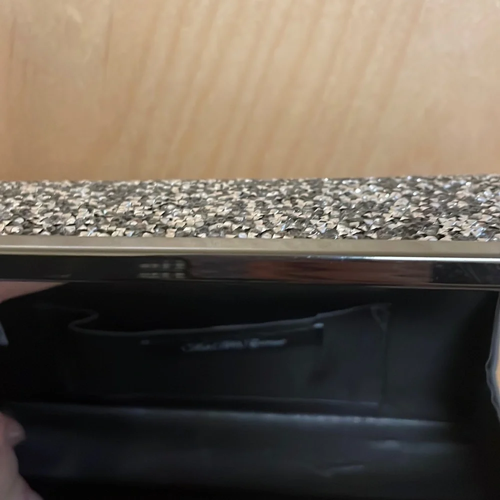 Saks Fifth Avenue sparkly gemstones clutch with chain link strap.